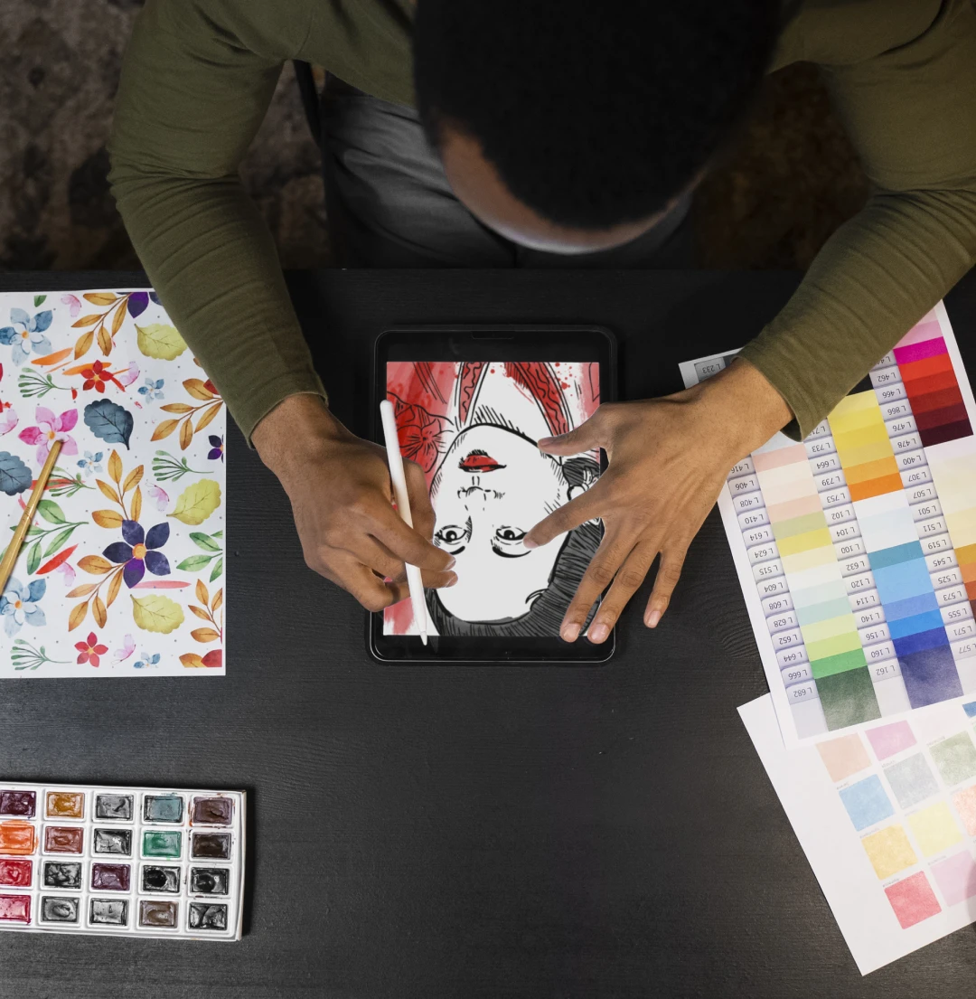 Man drawing a woman's sketch on tablet