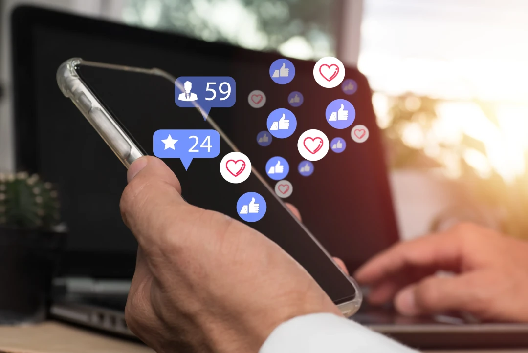 Likes and followers from social media emitting on a phone